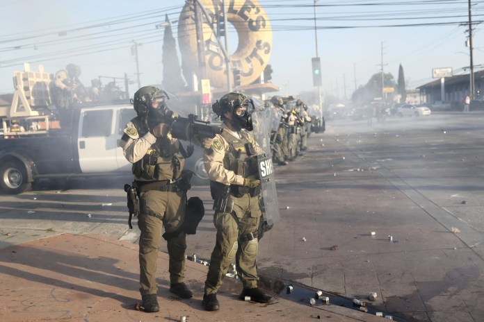 Trump curfew LA, ICE raids protests, Los Angeles unrest 2025, immigration crackdown USA, Marines deployed LA, anti-ICE protests, LA riots Trump