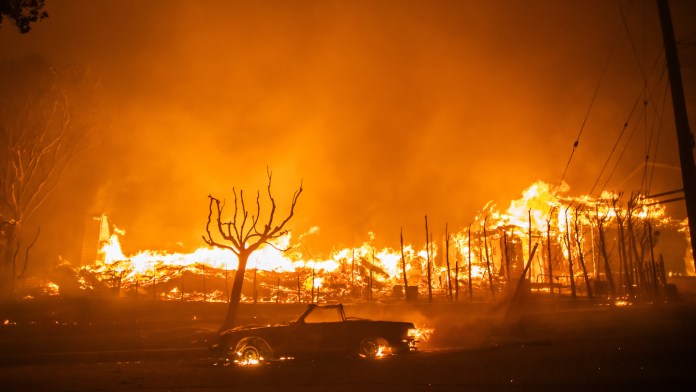 A home and car are consumed by flames in LA’s Palisades, one of five wildfires exposing the state’s failed disaster response Trump Los Angeles troops, California wildfires rebuild, Trump military deployment, LA protests ICE raids, Gavin Newsom Trump conflict, Insurrection Act Trump, federal vs state powers